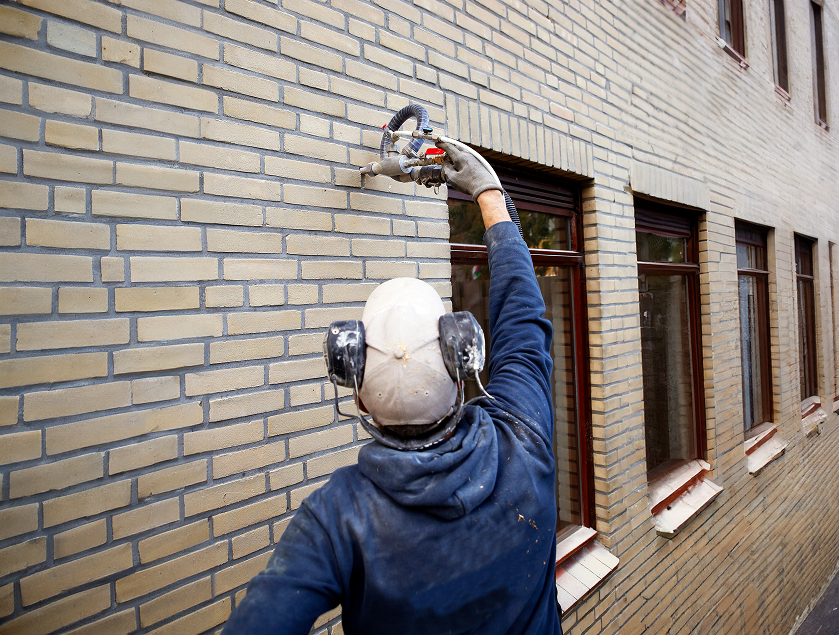 Drilling holes for cavity wall insulation injection