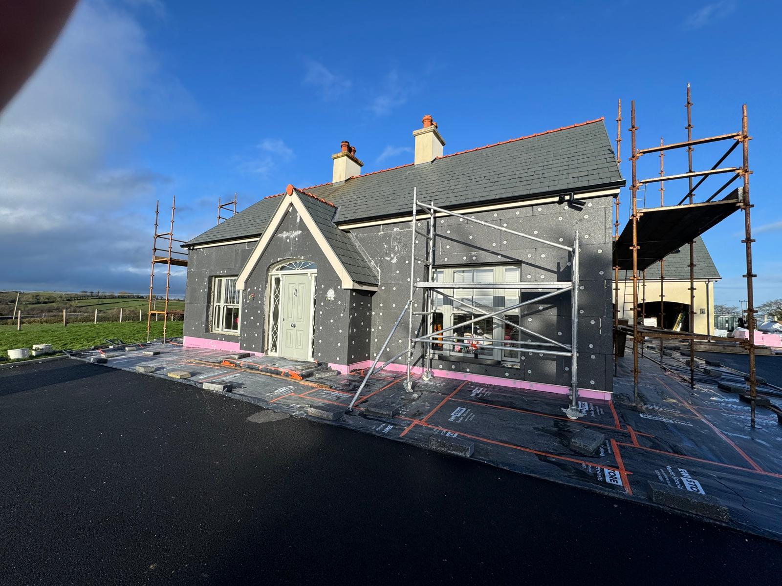 House after external wall insulation wrap completion